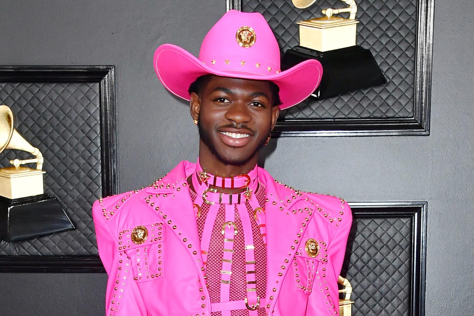 Image of Lil Nas X the rapper at the Grammy's wearing pink leather cowboy clothes